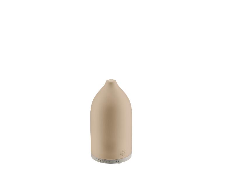 Diffuseur d'arômes en céramique beige avec boutons de commande en bas.