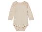 Bodys bébé manches longues, couleur beige clair.
