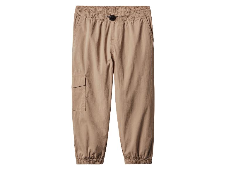 Pantalon cargo beige avec taille élastique et chevilles élastiques.