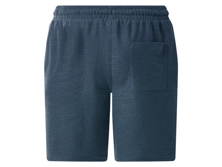 Short de survêtement bleu avec taille élastique et poche arrière.