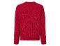 Un pull rouge en maille avec un effet brillant.