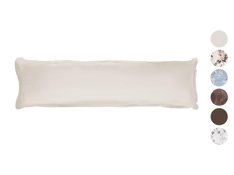 Oreiller beige sur fond blanc avec échantillons de couleurs et motifs.