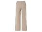 Pantalon beige à jambes larges.