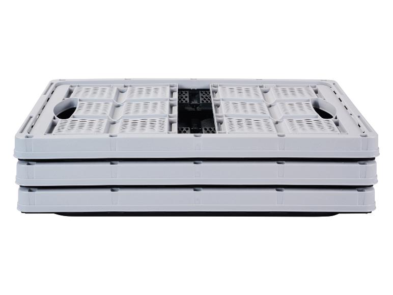 Caisses de rangement pliables grises empilées sur fond blanc.