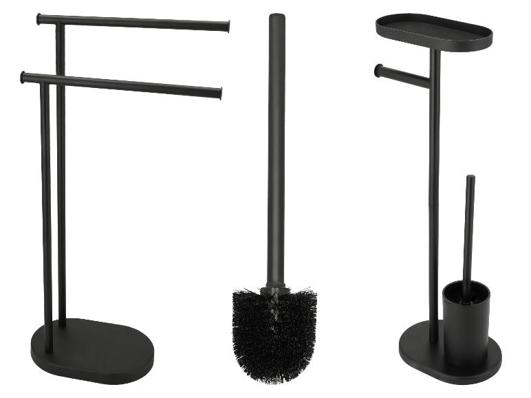 Porte-serviettes noir, brosse de toilette et porte-papier toilette avec étagère.