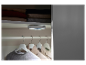 Éclairage LED pour placard, fixé au plafond, éclairant les vêtements suspendus.