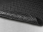 Un tapis de sol en caoutchouc noir avec un motif en losanges.