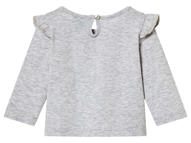 Un t-shirt à manches longues gris avec des volants pour bébés