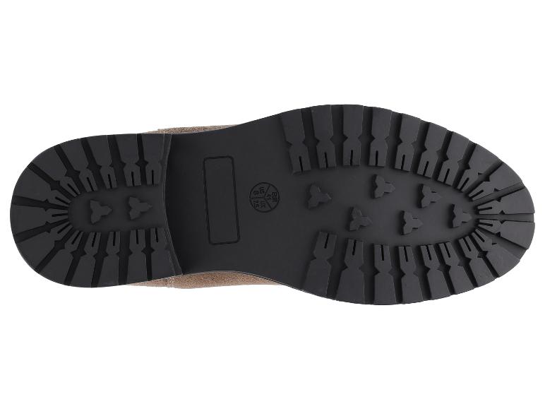 Semelle d'une botte marron avec motif de bande de roulement