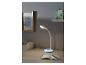 Lampe de bureau blanche avec base lumineuse, sur un bureau avec un carnet.