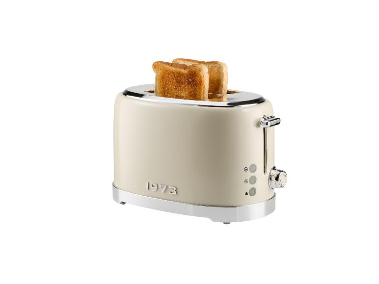 Un grille-pain crème 1973 avec du pain grillé.