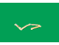Jouet en bois avec des formes colorées sur fond vert.