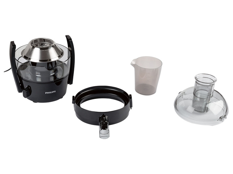 Les pièces d'un extracteur de jus Philips, y compris une carafe à jus