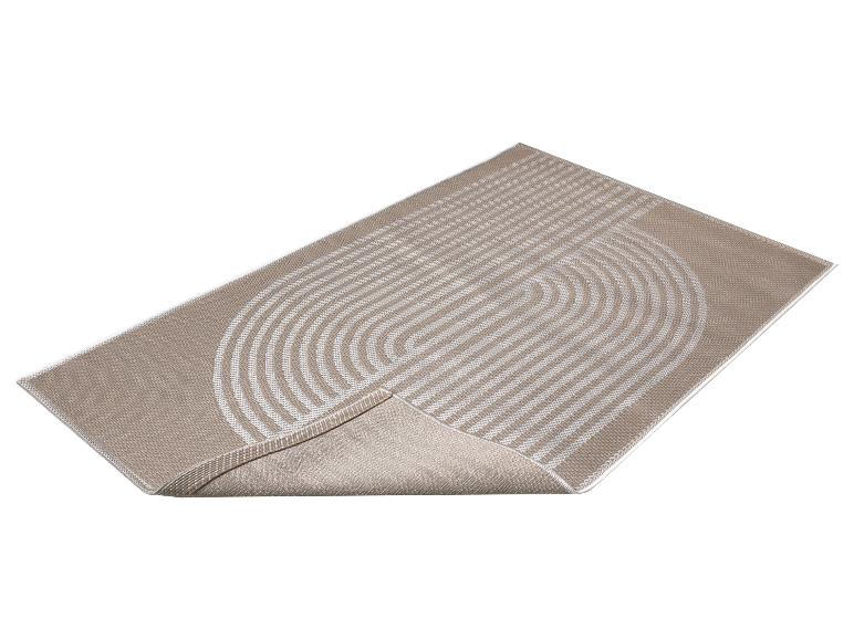 Tapis beige avec un motif géométrique de lignes blanches