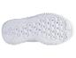 Semelle blanche d'une chaussure de course Nike avec un motif en nid d'abeille.