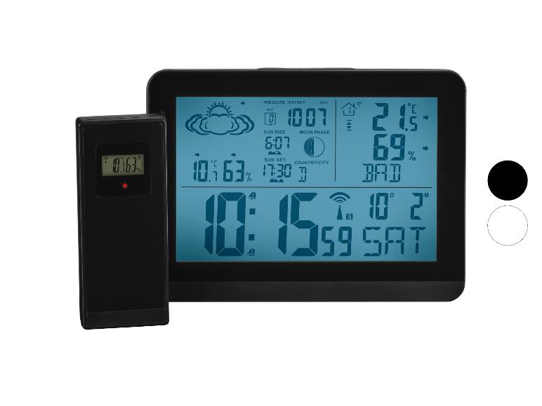 Station météo numérique avec capteur sans fil, affichant l'heure, la date, la température et l'humidité.