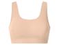 Soutien-gorge de sport beige sans couture pour femme.