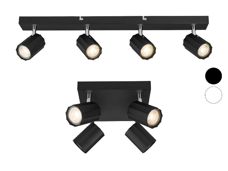 Spots de plafond et muraux noirs montés sur rail droit et base carrée.