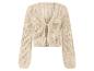 Gilet beige en tricot ajouré, détail noué.