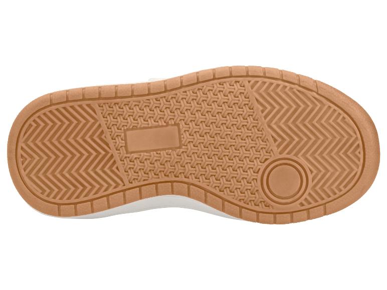 Semelle de chaussure de sport marron avec une bande de roulement à motifs.