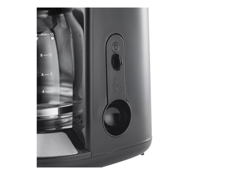 Cafetière noire avec carafe en verre et indicateur de niveau d'eau.