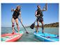 Deux personnes pratiquent le paddleboard sur des planches gonflables Exotic et Aqua Marina Allround.