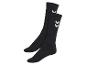 Deux paires de chaussettes noires Hummel avec des logos chevron blancs.