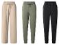 Trois pantalons de survêtement de couleurs différentes : un pantalon large beige et des joggings verts, noirs.