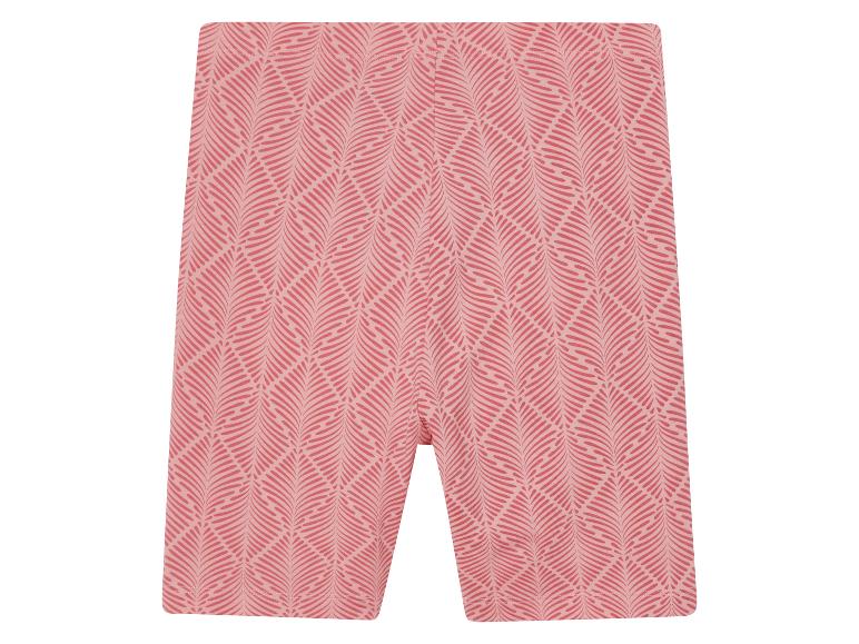 Short cycliste rose à motif feuillage.