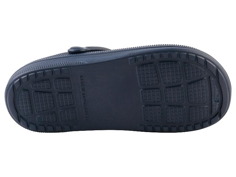 La semelle bleue d'une paire de sandales avec un motif en grille.