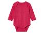 Body bébé rose à manches longues.