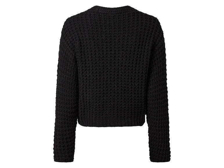 Pull noir en tricot, vu de dos.
