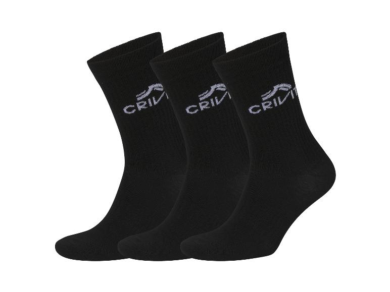 Trois paires de chaussettes noires Crivit sur fond blanc.