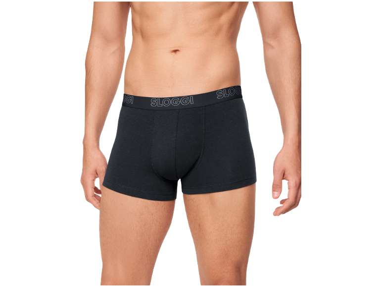 Homme en caleçon noir avec ceinture élastique avec texte.