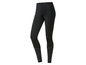 Leggings noires avec des points blancs en bas.