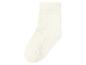 Chaussette unie de couleur crème avec une texture côtelée