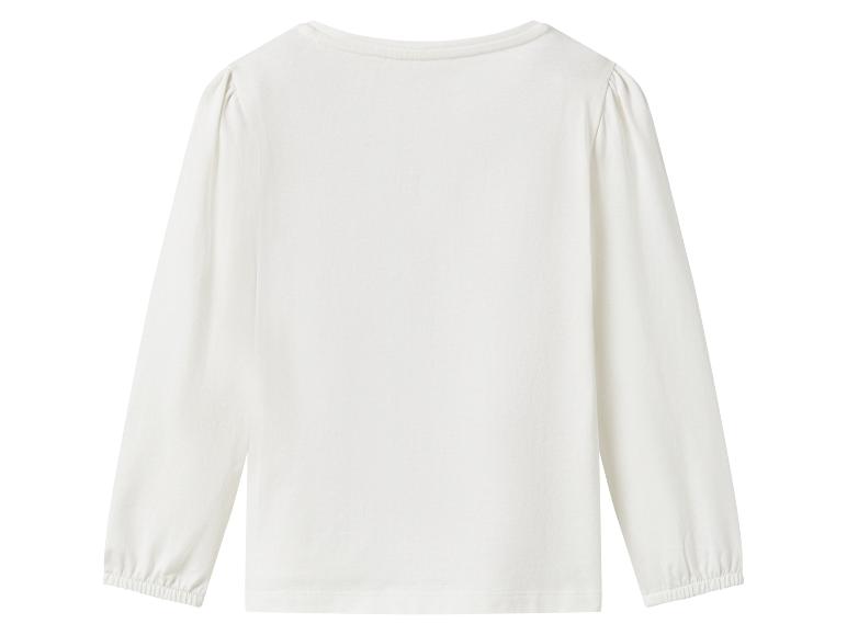 Haut blanc à manches longues pour enfant.