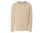 Un t-shirt à manches longues rayé beige.