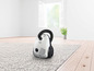 Un aspirateur Bosch blanc sur un tapis blanc.