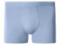 Caleçon boxer bleu clair avec ceinture élastique et rayures blanches.