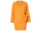 Une robe orange à manches longues avec un nœud.