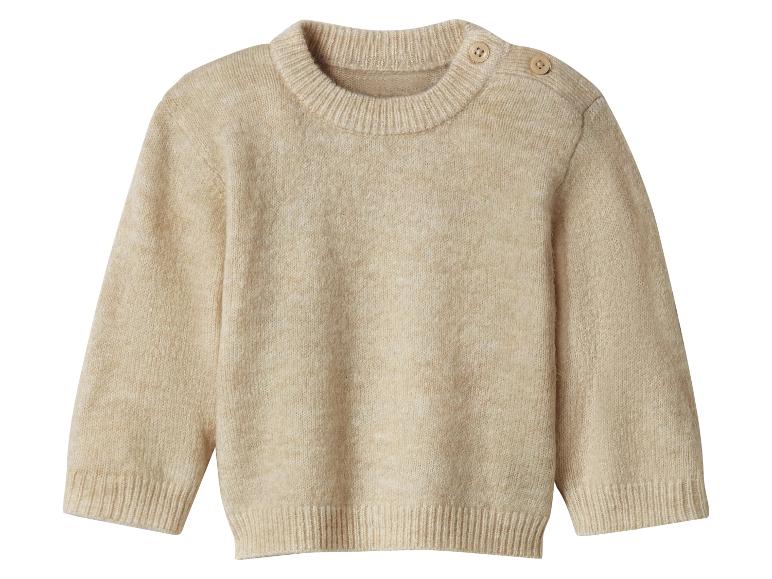 Pull bébé tricoté beige avec boutons sur l'épaule
