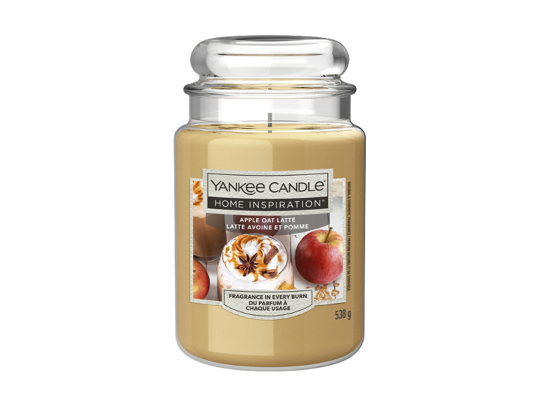Bougie parfumée latte pomme avoine dans un pot en verre, avec une image de latte et de pommes.