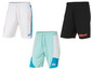 Trois paires de shorts de sport Mistral en blanc, noir et bleu clair.