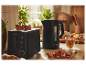 Un grille-pain et une bouilloire SilverCrest noirs dans une cuisine moderne.
