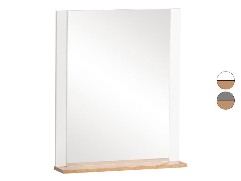 Miroir mural rectangulaire avec cadre blanc et étagère en bois clair.