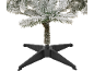 Sapin de Noël artificiel enneigé avec support en plastique noir.