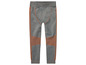 Leggings de sport gris avec des détails orange.