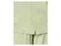 Gros plan d'un tissu vert clair avec un motif diagonal, probablement une partie d'un costume ou d'un pantalon.