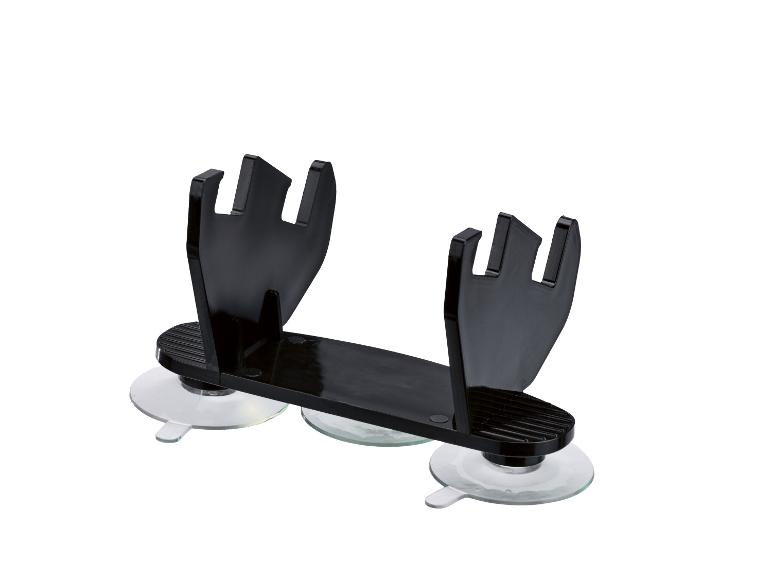 Support ventouse noir pour brosses à maquillage.